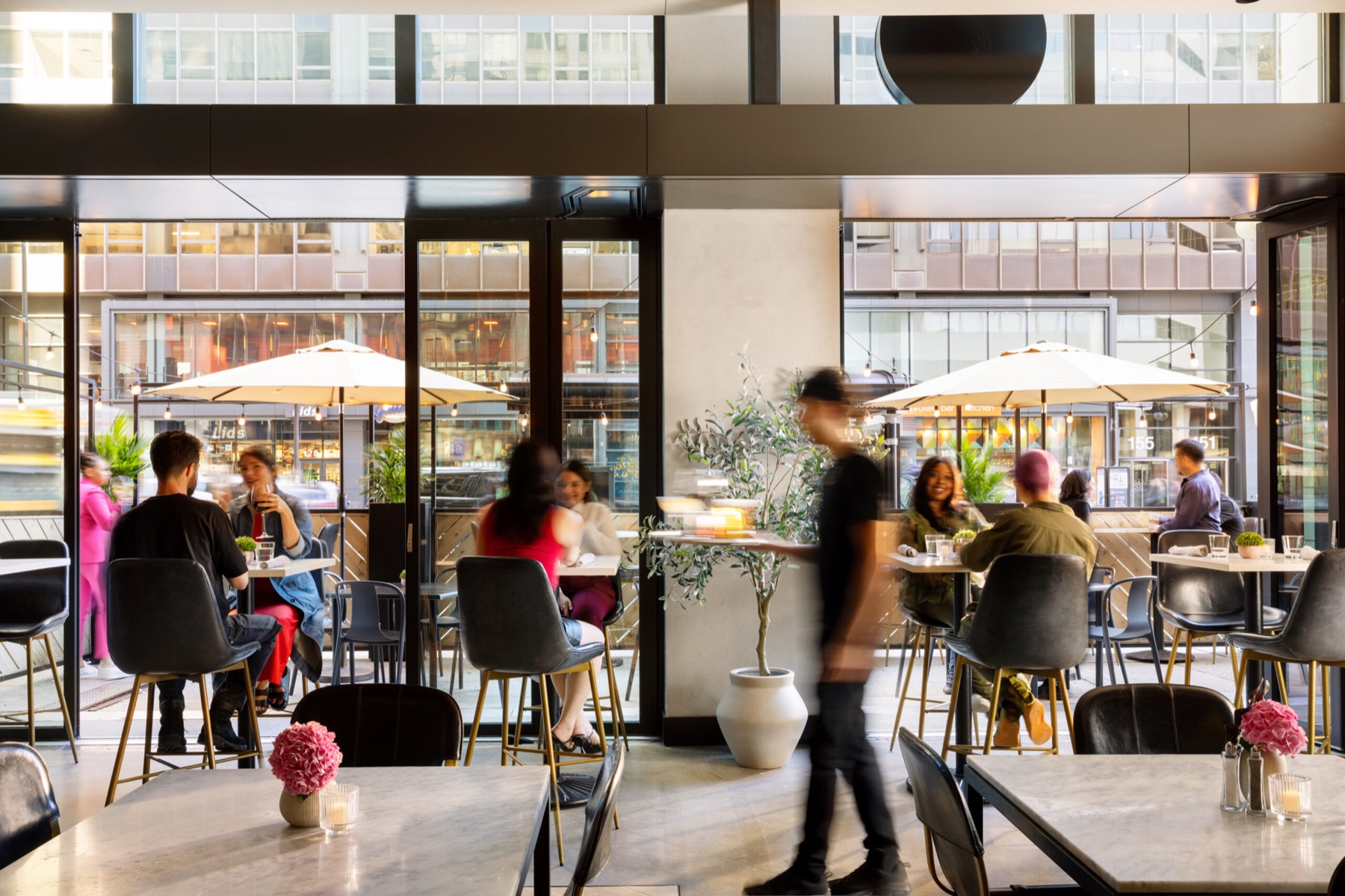 The bright, lively restaurant and lobby space at Arlo Chicago
