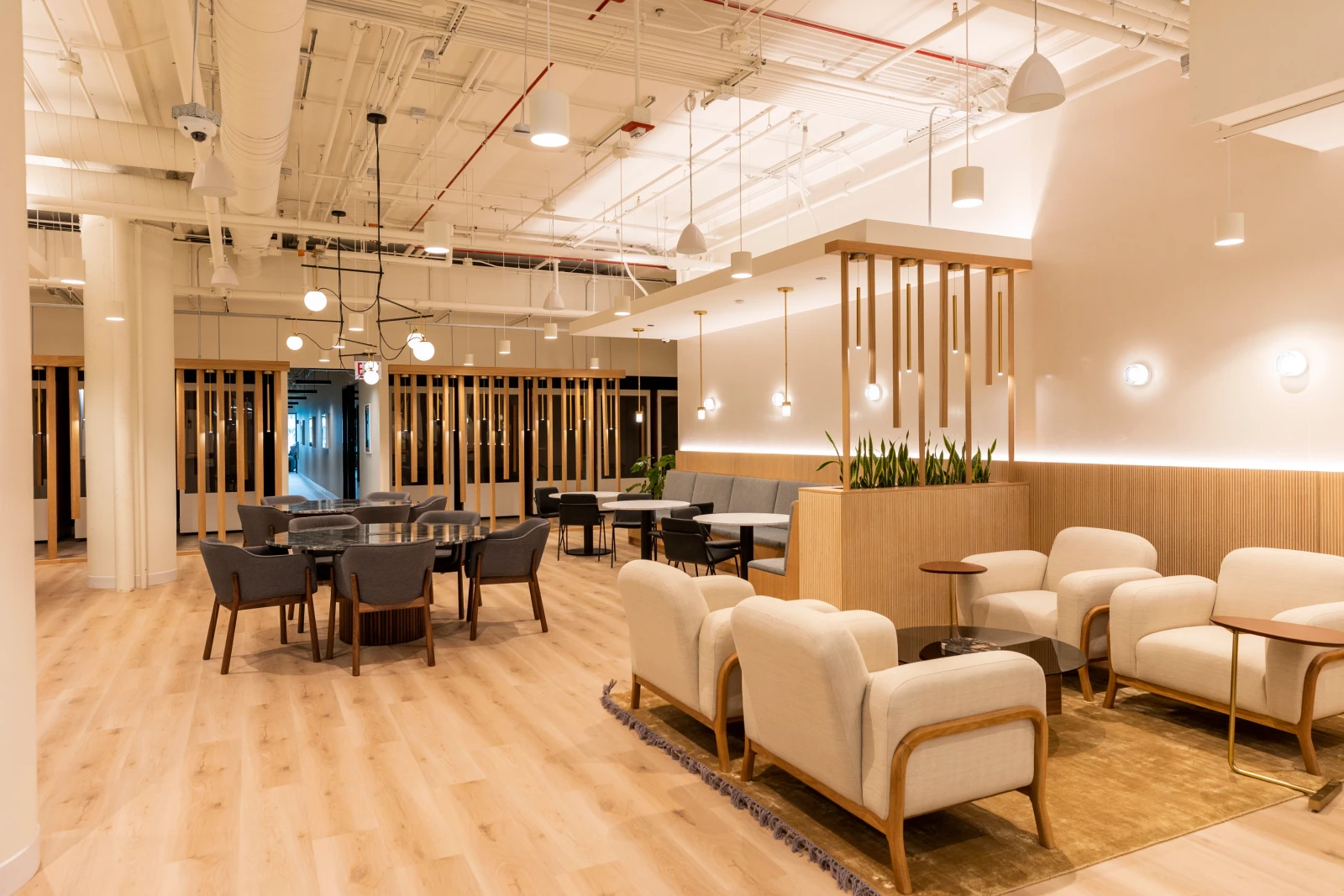 Warm, modern shared lounge at Industrious Millennium Park in Chicago
