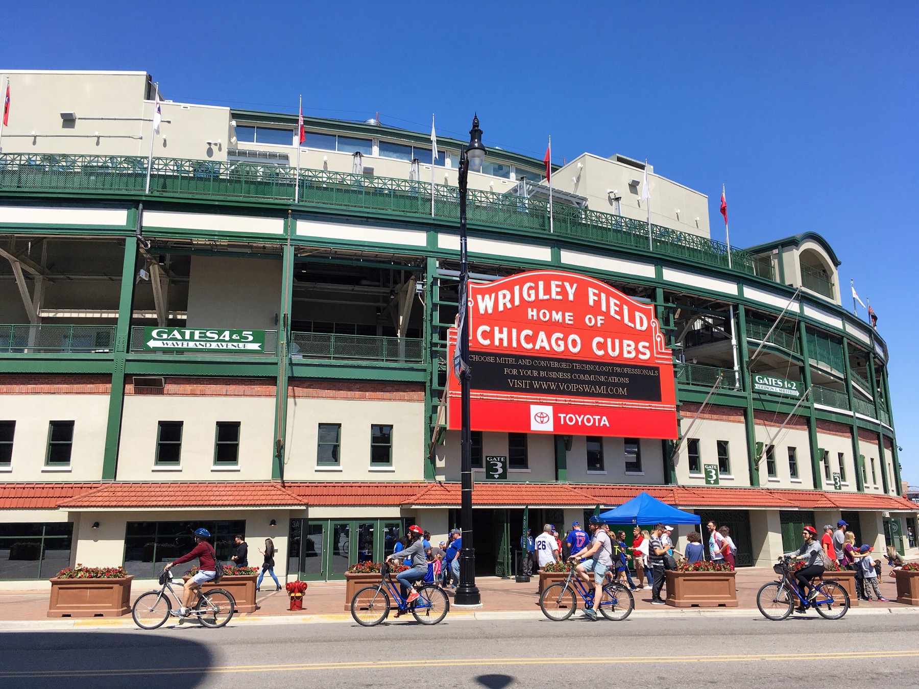 The Wrigley Field marquee and stadium exterior on a sunny day